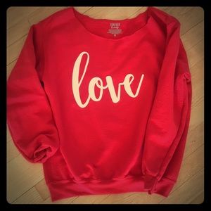 Red off-the shoulder “Love” sweater